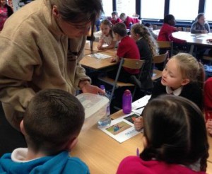 Me showing school children the Brown trout eggs