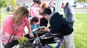Party On The Green! Happy people planting up mini edible gardens