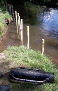 A post basher was used to put stakes into the stream floor