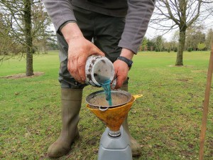 The contents of the jar are then poured through a sieve