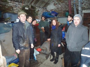 The NFM Vols. sheltering inside a farm shed for a celebratory cup of tea post-planting!