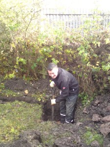 Stuart knee-deep in a drainage sump