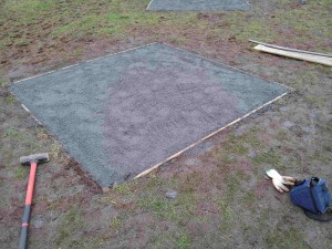 Wooden edges with grey wind dust on to of type 1 gravel. Areas for benches and tables. 